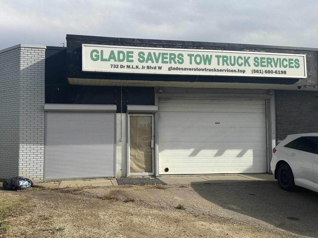 Glade Savers Tow Truck Services storefront sign on Dr M.L.K. Jr Blvd W in Belle Glade